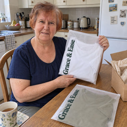 A customer with her Grace & Ease t-shirts