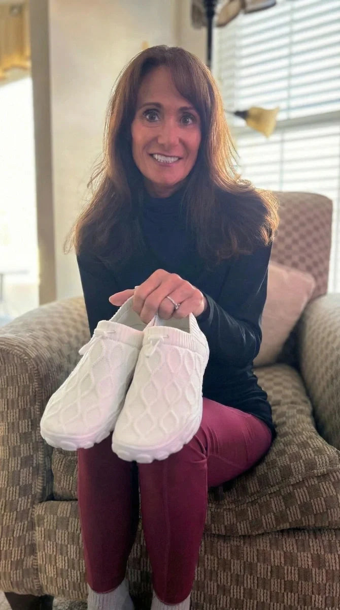 Grace & Ease customer at home with her new white pair