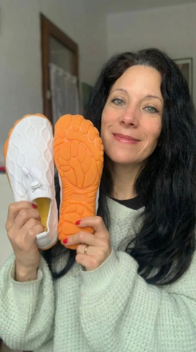 Grace & Ease customer showing the grippy sole of her new white pair